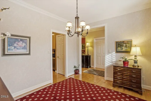 a bedroom with bed and wooden floor