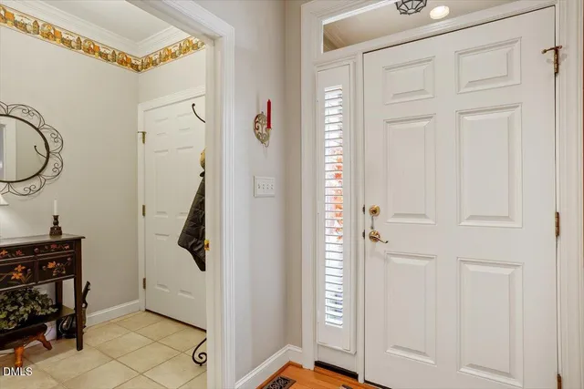 a view of an entryway with wooden floor