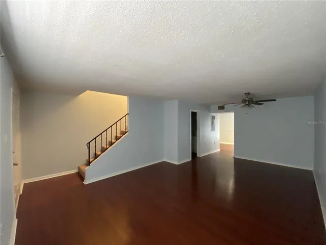 a view of an entryway with wooden floor