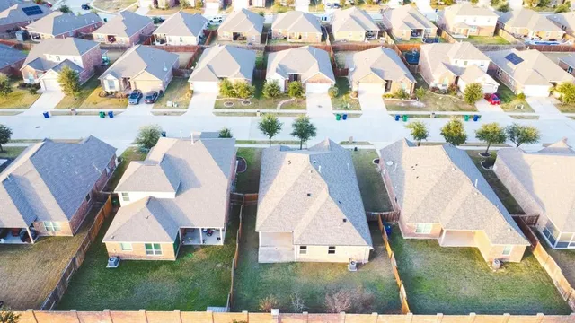 a view of city and ocean with beach