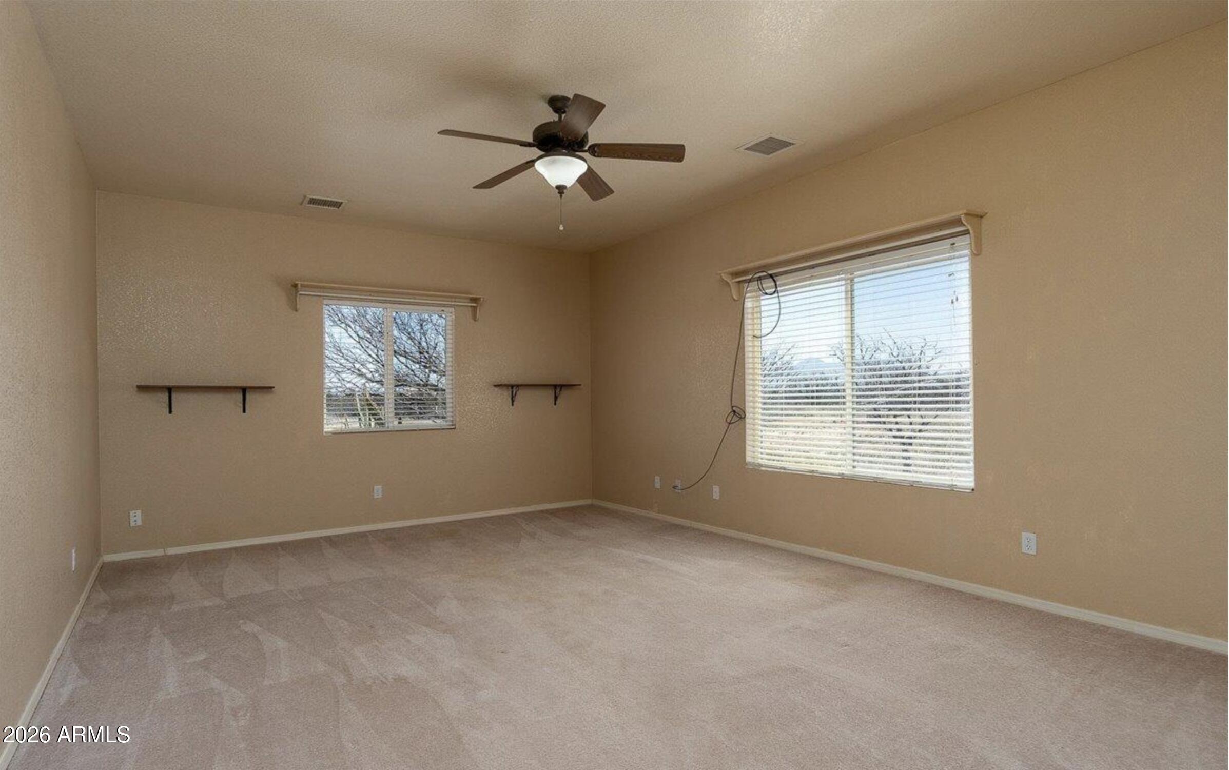 10193 East Windtalker Road Hereford, AZ 85615 - Photo 16 of 34 a view of an empty room with a window