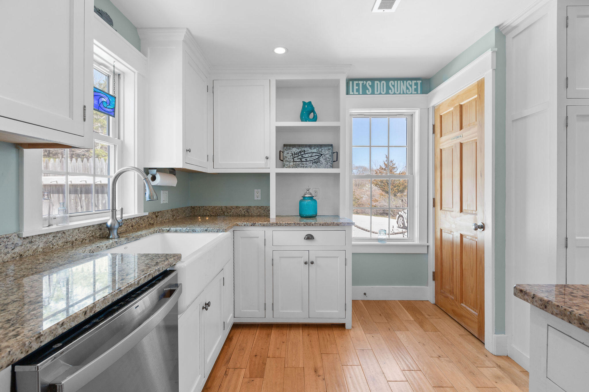 16 Hughes Road Truro, MA 02666 - Photo 15 of 50 a kitchen with granite countertop a sink cabinets stainless steel appliances and a window