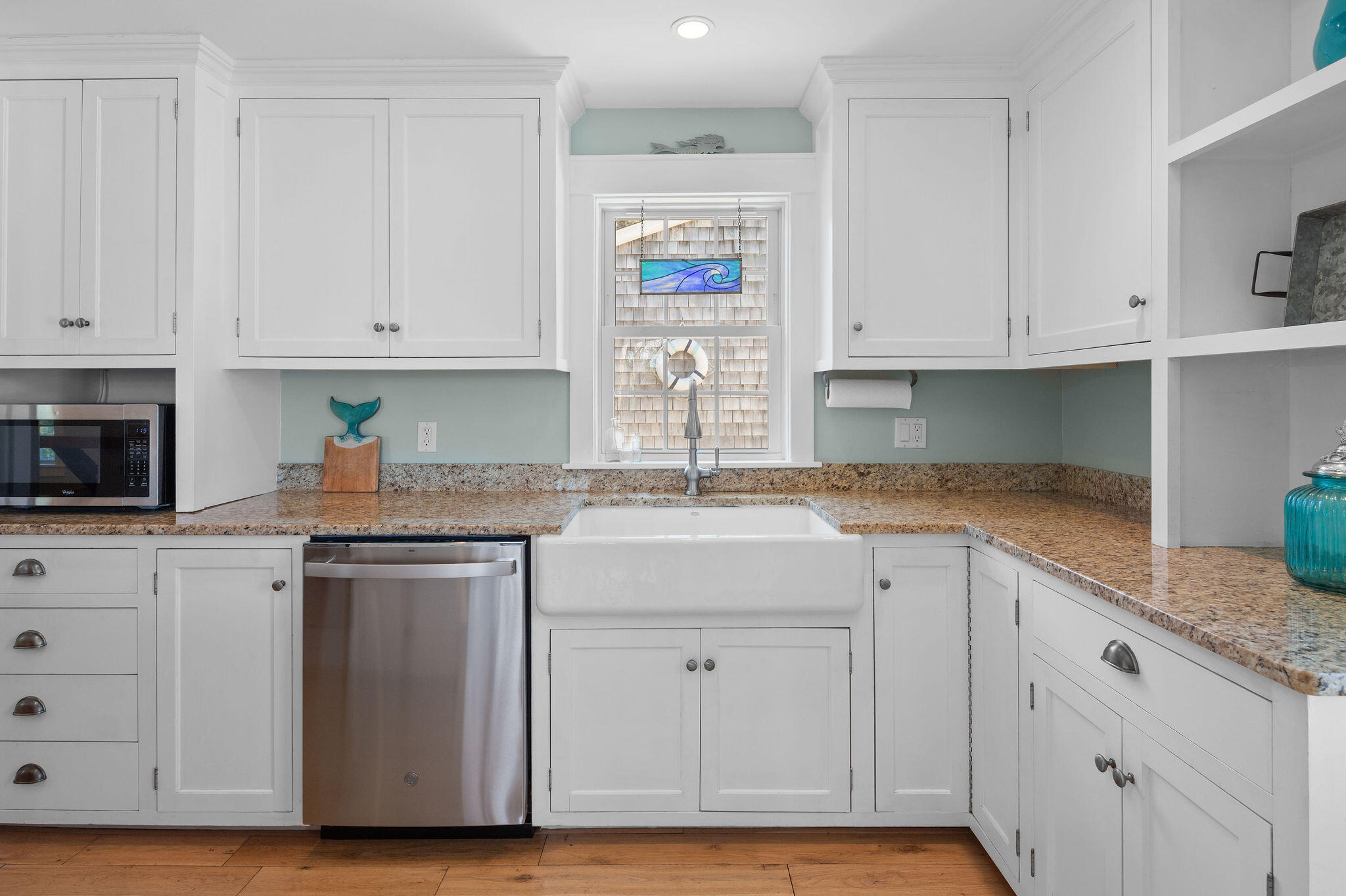 16 Hughes Road Truro, MA 02666 - Photo 16 of 50 a kitchen with granite countertop white cabinets and stainless steel appliances