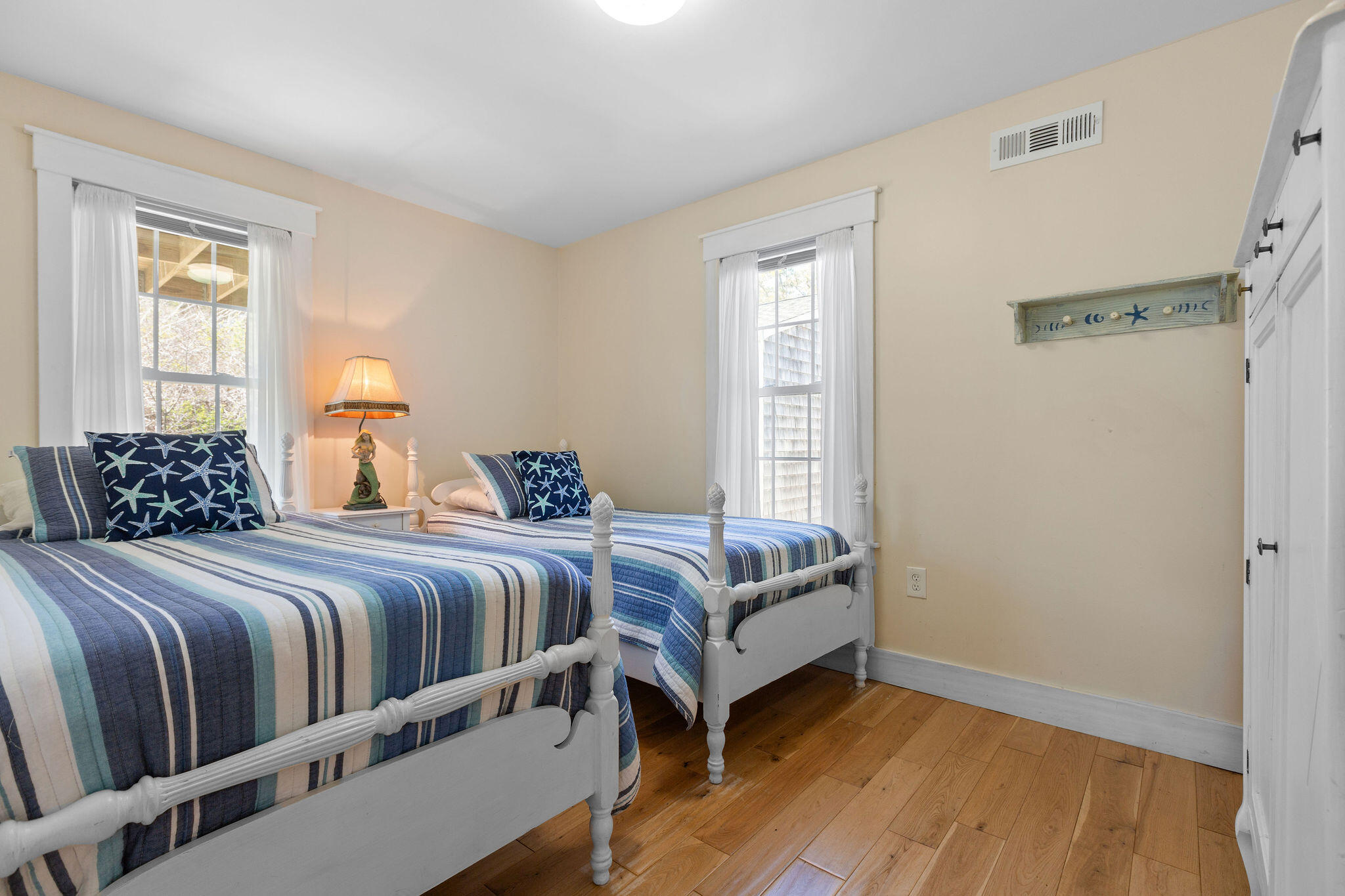16 Hughes Road Truro, MA 02666 - Photo 25 of 50 a bedroom with a bed and wooden floor