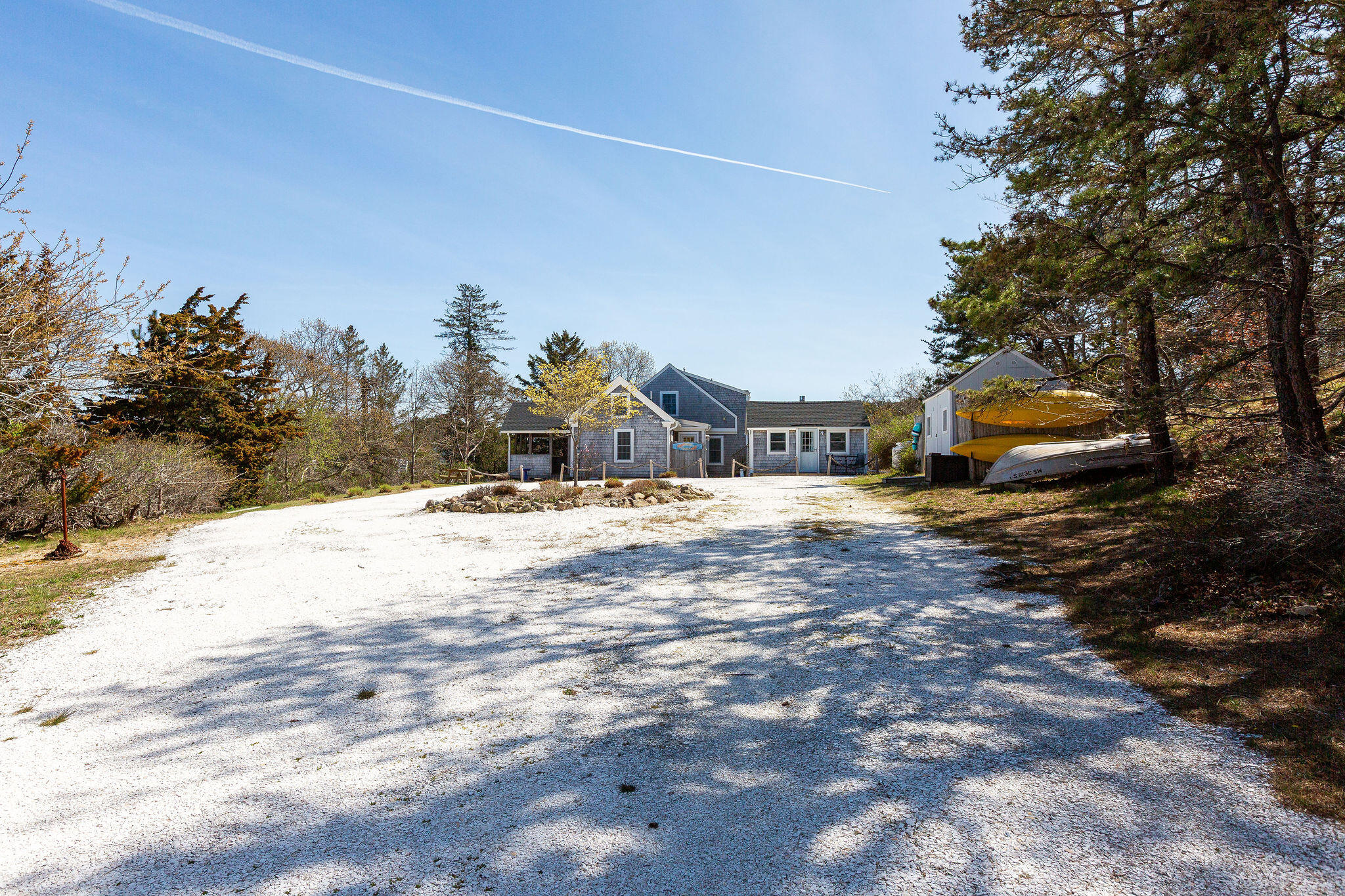 16 Hughes Road Truro, MA 02666 - Photo 3 of 50 a house with trees in the background