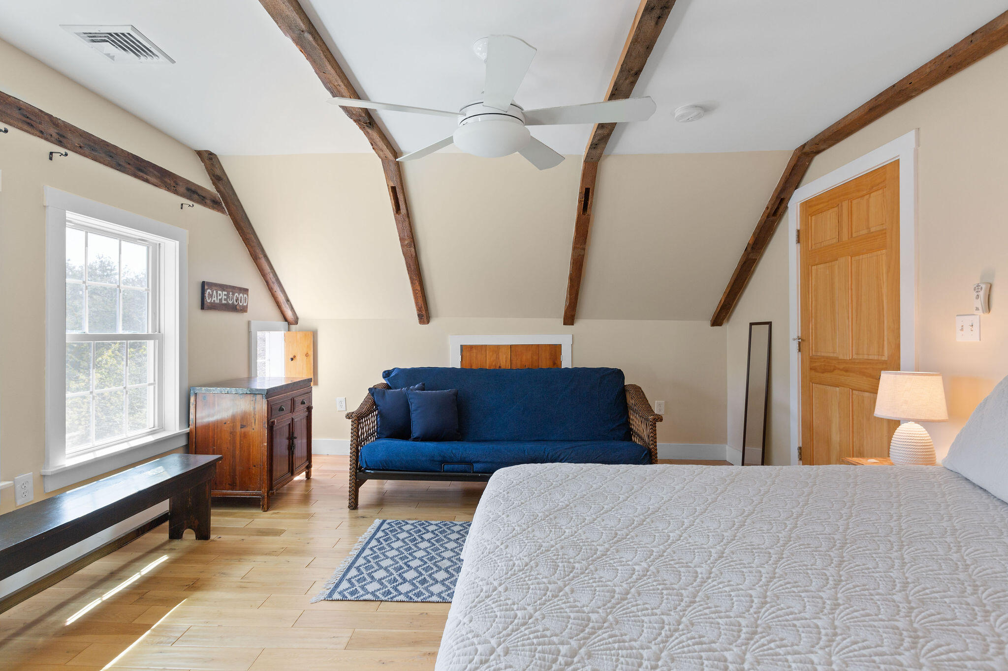 16 Hughes Road Truro, MA 02666 - Photo 34 of 50 a bedroom with a bed and wooden floor