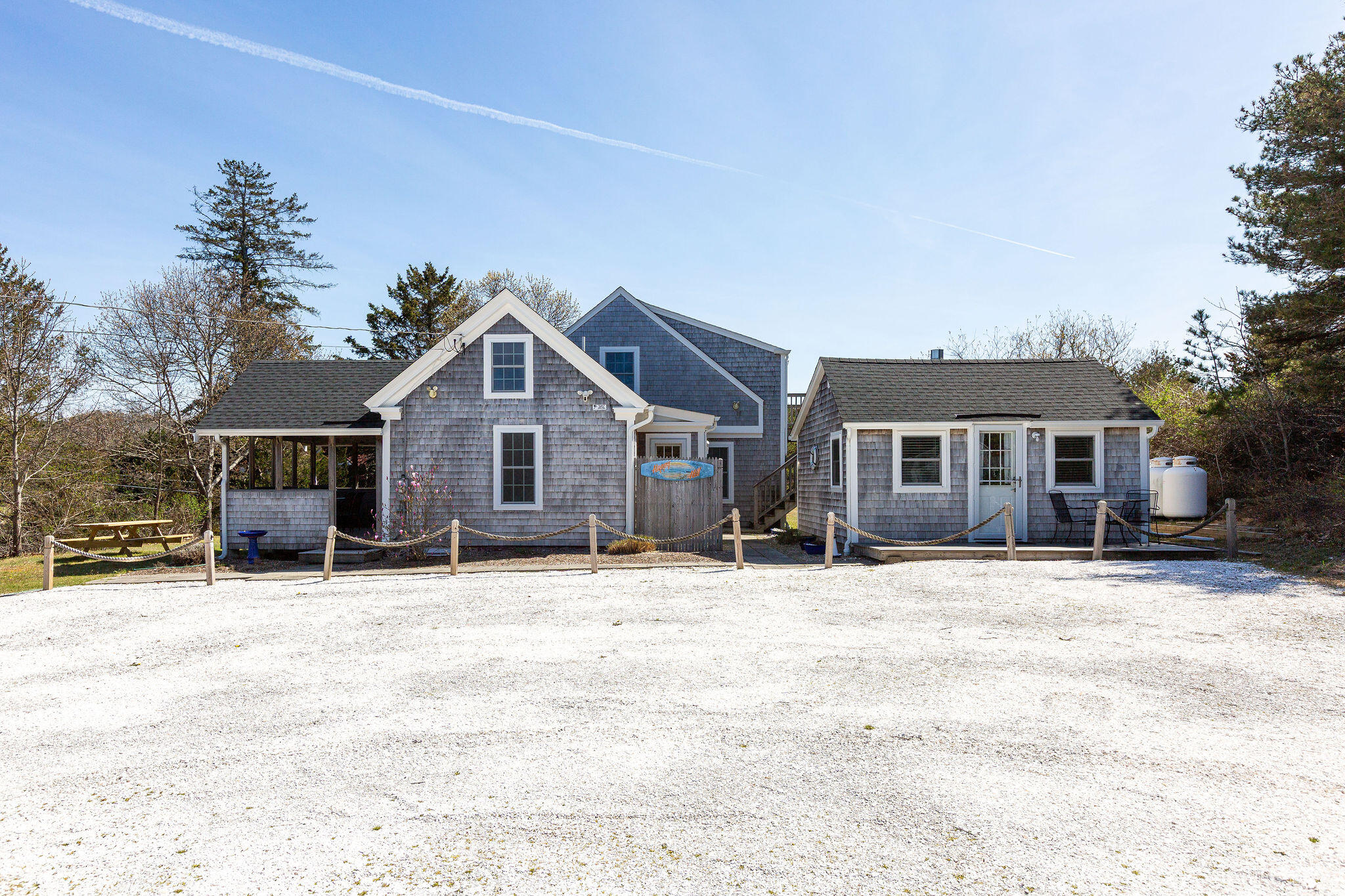 16 Hughes Road Truro, MA 02666 - Photo 4 of 50 a front view of a house with a yard