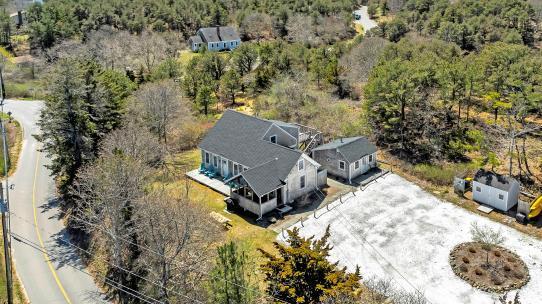 16 Hughes Road Truro, MA 02666 - Photo 45 of 50 an aerial view of a house with a yard and lake view