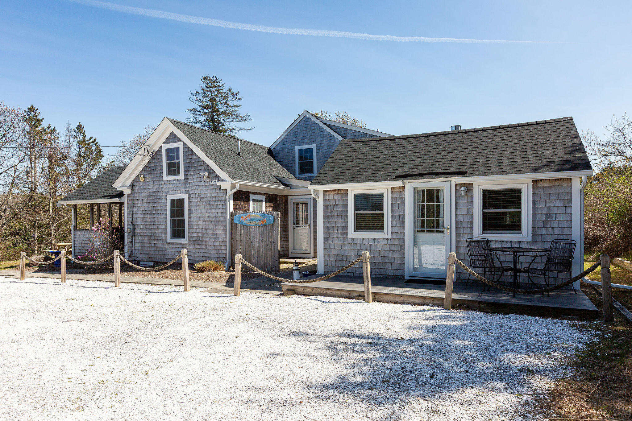 16 Hughes Road Truro, MA 02666 - Photo 5 of 50 a view of a house with a yard in the background