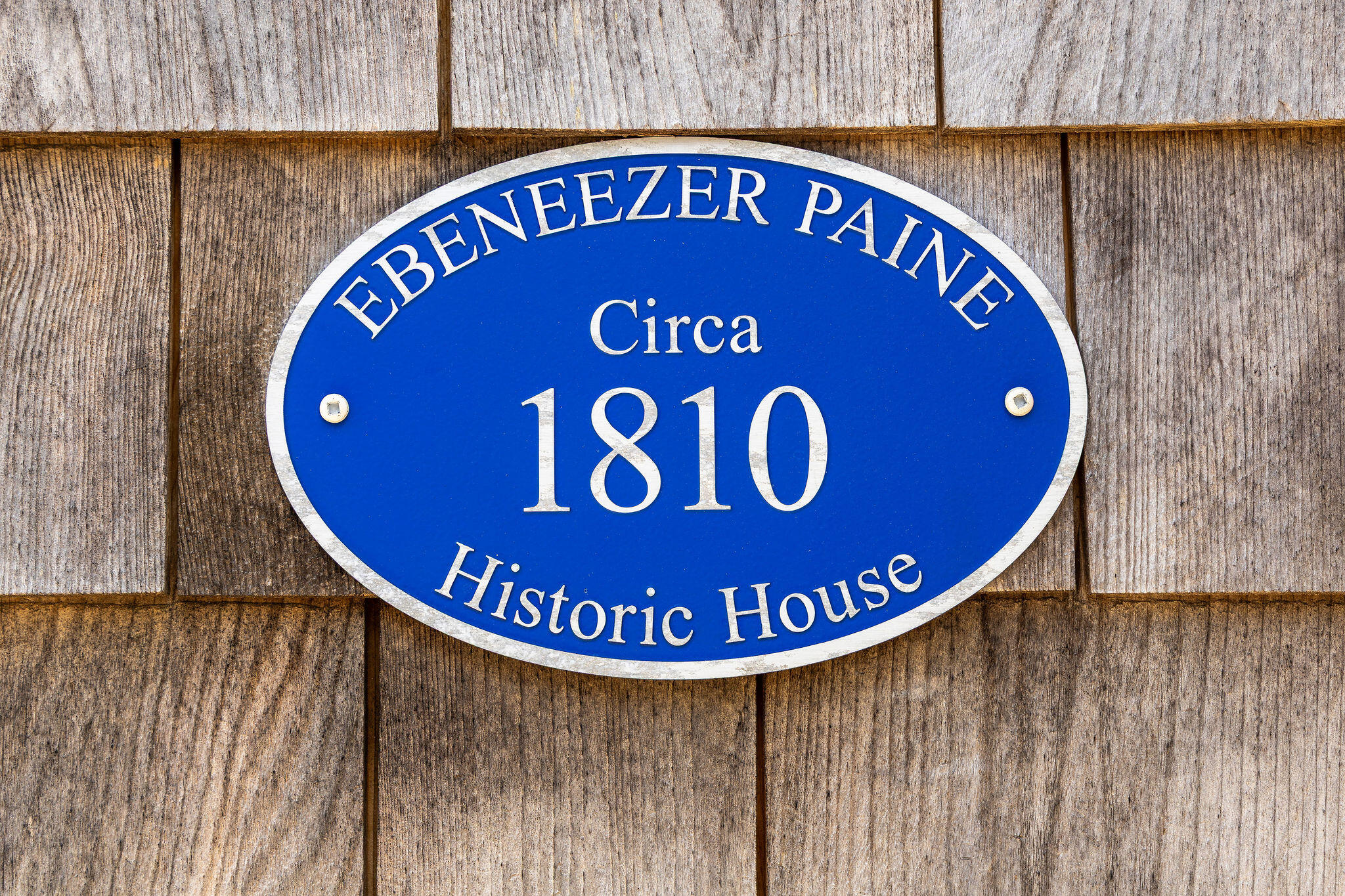 16 Hughes Road Truro, MA 02666 - Photo 7 of 50 a blue sign that is on a wooden wall