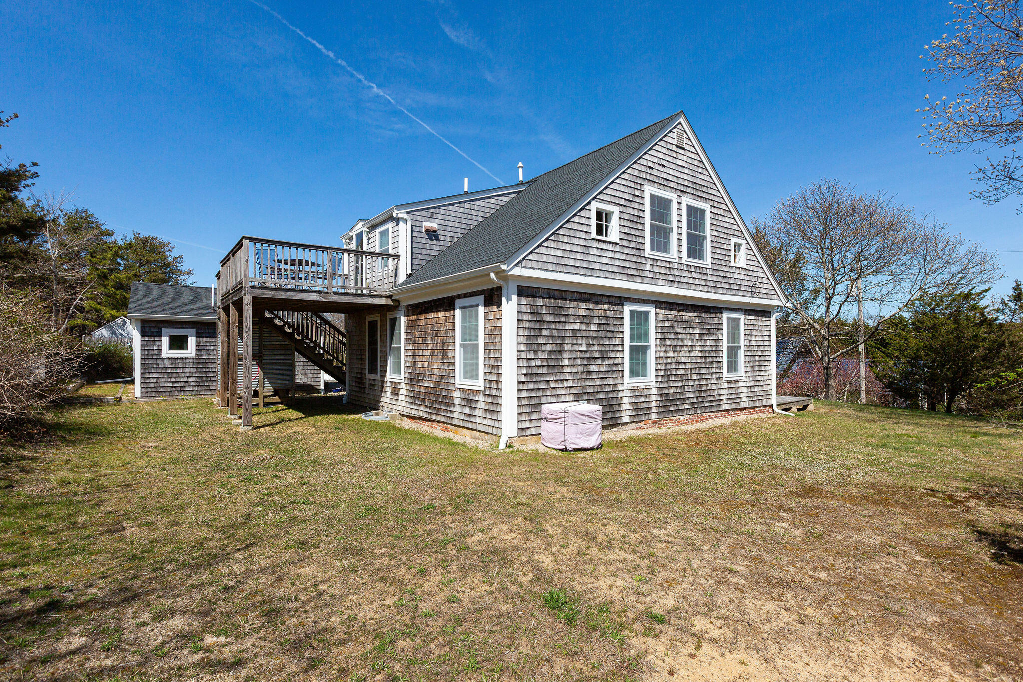16 Hughes Road Truro, MA 02666 - Photo 10 of 50 a front view of a house with a yard