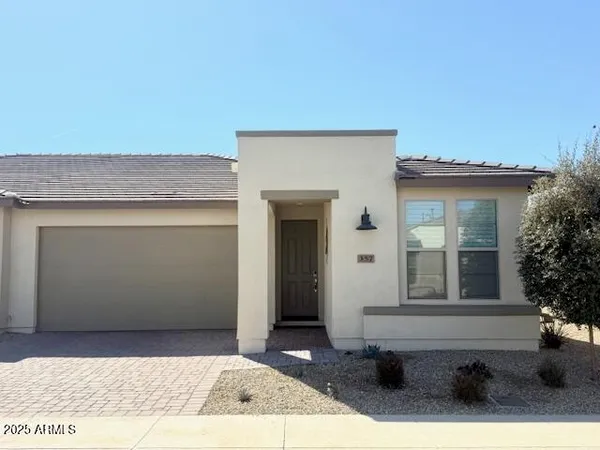 a front view of a house with a outdoor space