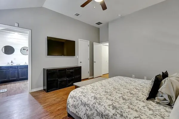 a bedroom with a bed and a fireplace