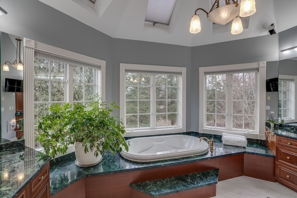 286 Shadyside Avenue Concord, MA 01742 - Photo 14 of 35 a room with lots of potted plants and windows
