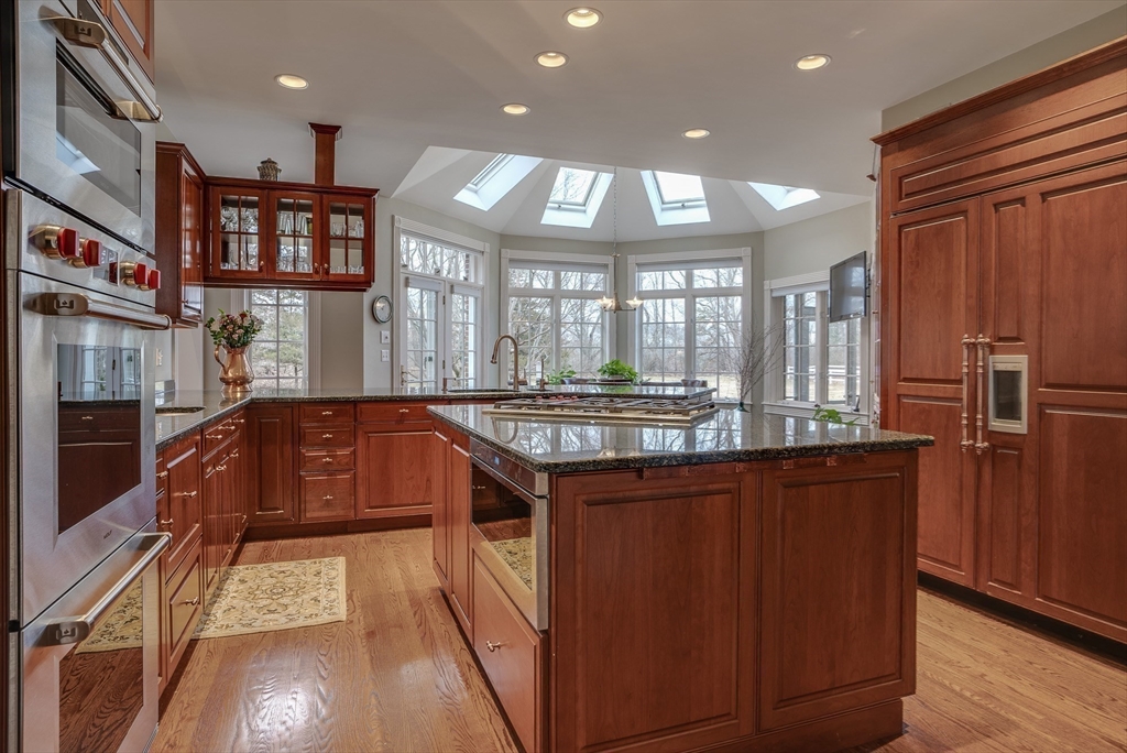 286 Shadyside Avenue Concord, MA 01742 - Photo 6 of 35 a kitchen with stainless steel appliances granite countertop a stove a sink and a refrigerator