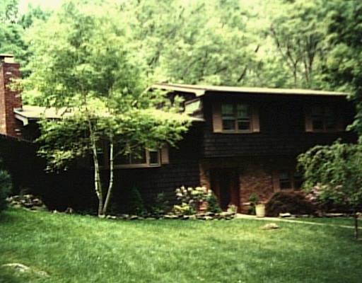30 Old West Mountain Road Ridgefield, CT 06877 - Photo 1 of 1 a backyard of a house with lots of green space