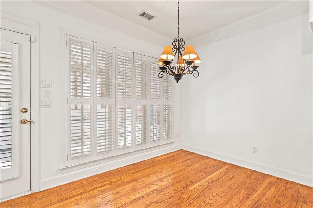 4751 Rosebrook Place Southeast Atlanta, GA 30339 - Photo 11 of 59 a view of a livingroom with a chandelier wooden floor and a chandelier