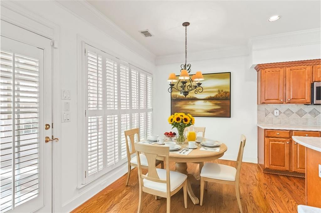 4751 Rosebrook Place Southeast Atlanta, GA 30339 - Photo 12 of 59 a view of a dining room with furniture window and wooden floor