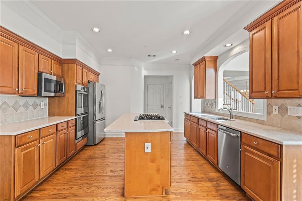 4751 Rosebrook Place Southeast Atlanta, GA 30339 - Photo 15 of 59 a large kitchen with stainless steel appliances granite countertop a stove a sink dishwasher and a refrigerator