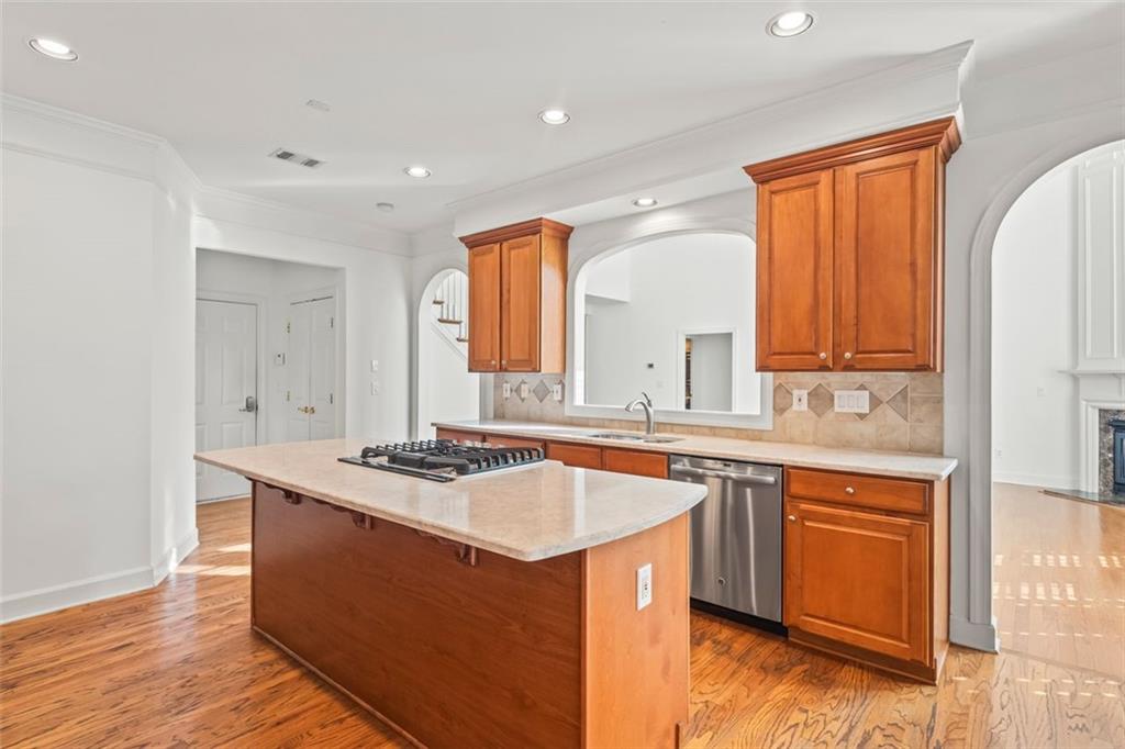 4751 Rosebrook Place Southeast Atlanta, GA 30339 - Photo 16 of 59 a kitchen with stainless steel appliances granite countertop a sink stove and refrigerator