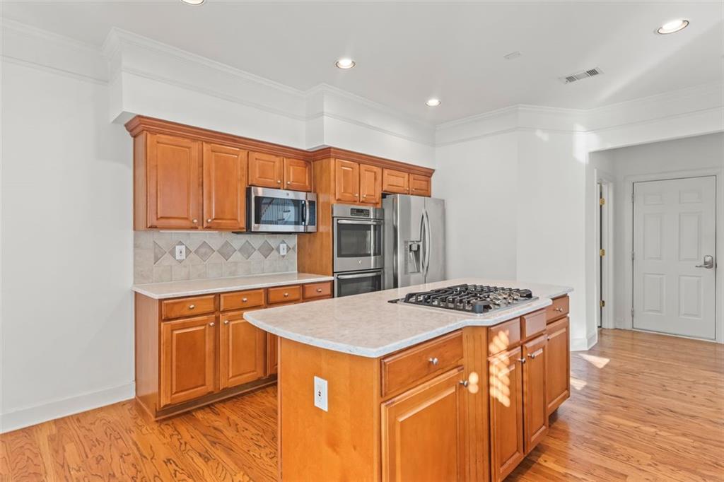 4751 Rosebrook Place Southeast Atlanta, GA 30339 - Photo 17 of 59 a kitchen that has a stove a sink and a refrigerator