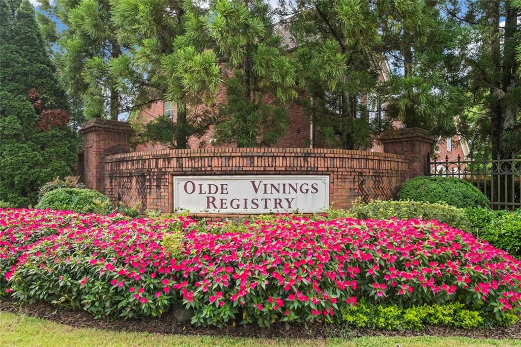 4751 Rosebrook Place Southeast Atlanta, GA 30339 - Photo 2 of 59 a sign that is in front of flowers