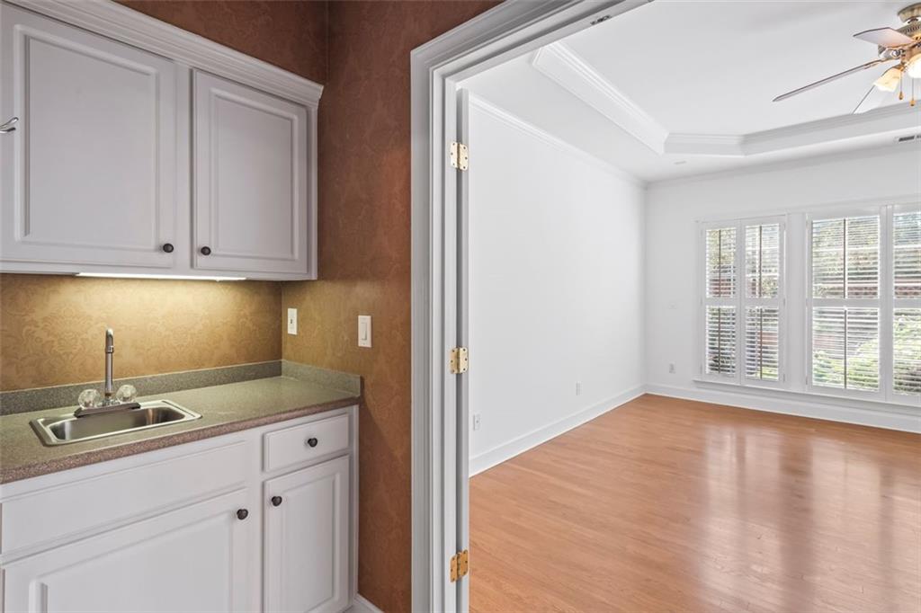 4751 Rosebrook Place Southeast Atlanta, GA 30339 - Photo 25 of 59 a kitchen with stainless steel appliances granite countertop a sink window and cabinets