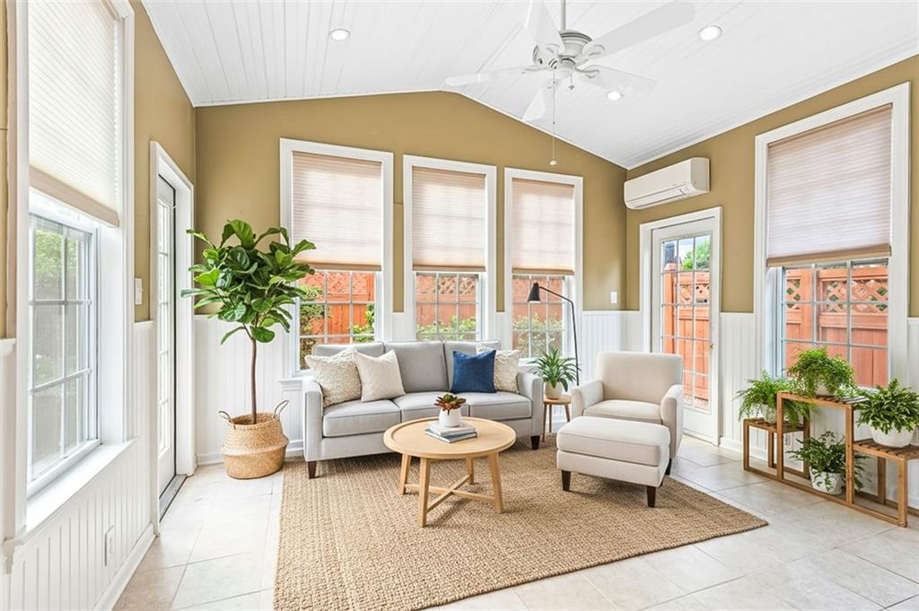 4751 Rosebrook Place Southeast Atlanta, GA 30339 - Photo 31 of 59 a living room with furniture and a large window with garden view