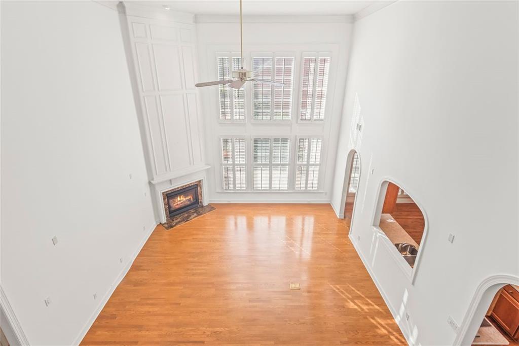 4751 Rosebrook Place Southeast Atlanta, GA 30339 - Photo 35 of 59 a view of an empty room with wooden floor and a window
