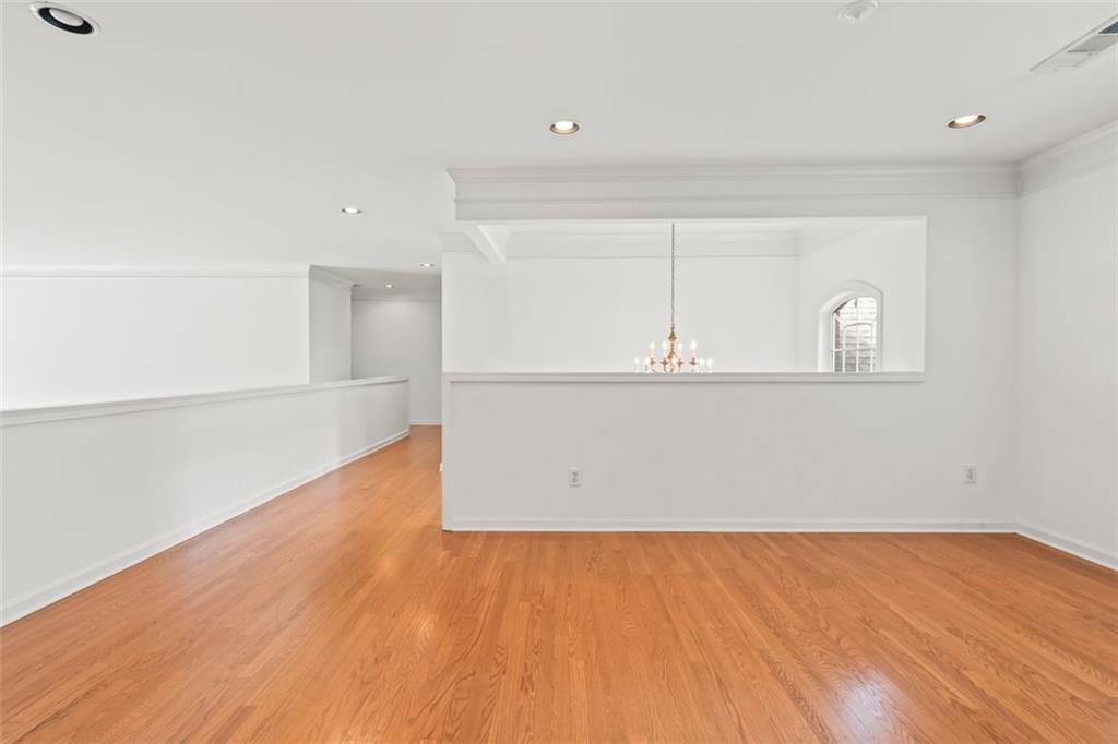 4751 Rosebrook Place Southeast Atlanta, GA 30339 - Photo 37 of 59 a view of a room with wooden floor and cabinet