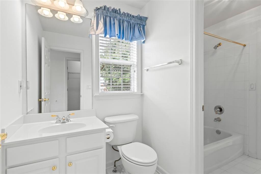 4751 Rosebrook Place Southeast Atlanta, GA 30339 - Photo 46 of 59 a bathroom with a sink a toilet and shower