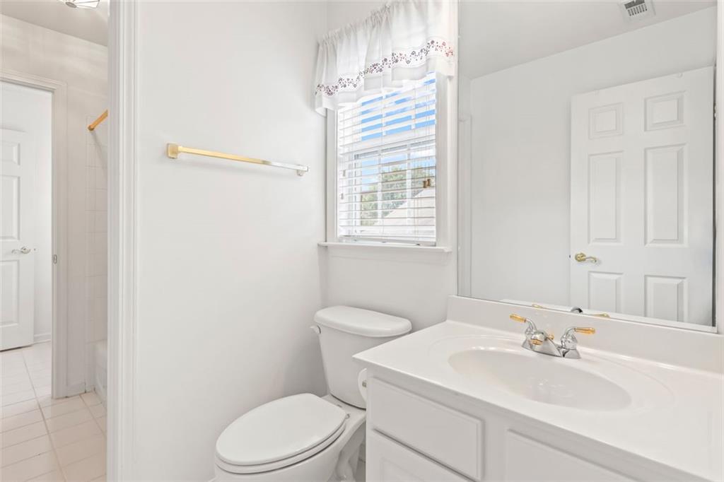 4751 Rosebrook Place Southeast Atlanta, GA 30339 - Photo 47 of 59 a bathroom with a sink a toilet and shower