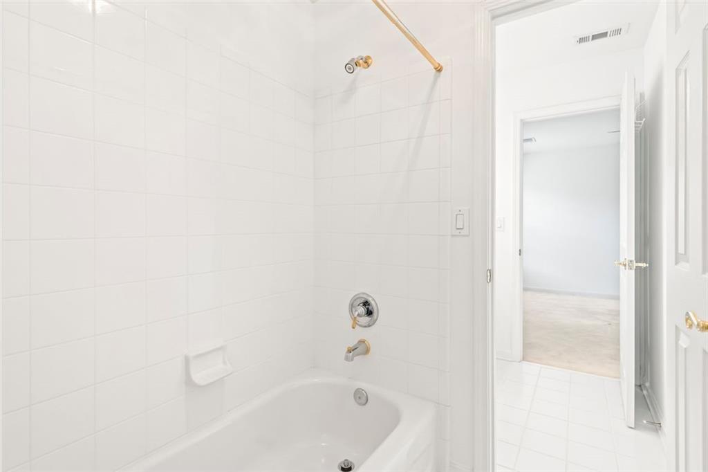 4751 Rosebrook Place Southeast Atlanta, GA 30339 - Photo 48 of 59 a bathroom with a bathtub