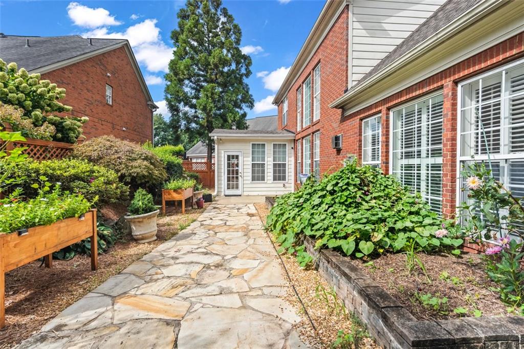 4751 Rosebrook Place Southeast Atlanta, GA 30339 - Photo 52 of 59 a front view of a house with garden