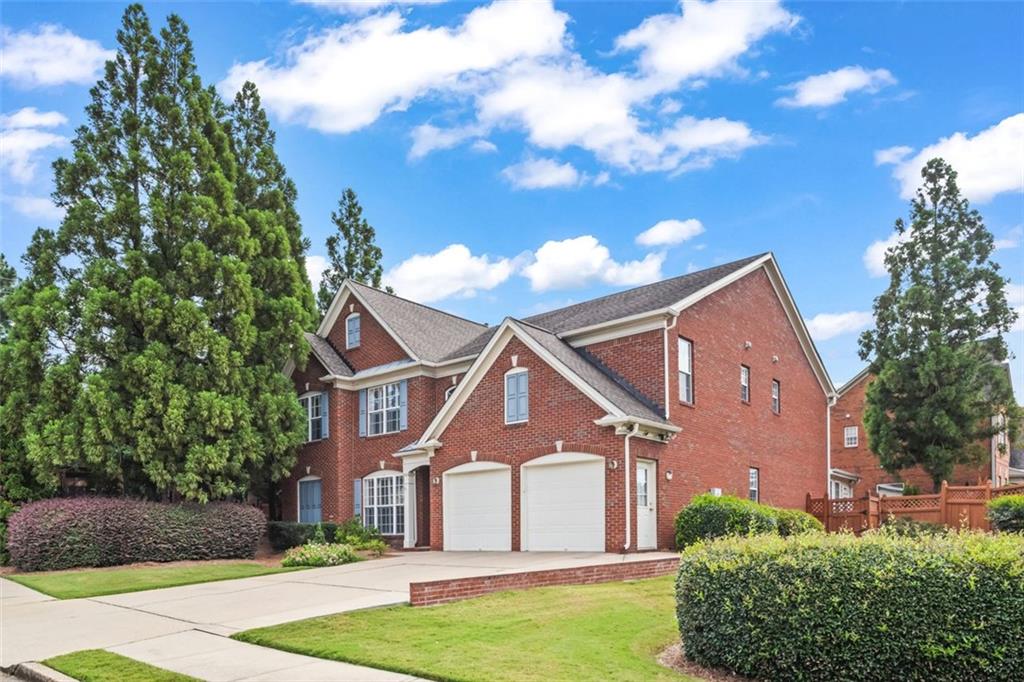 4751 Rosebrook Place Southeast Atlanta, GA 30339 - Photo 55 of 59 a front view of a house with a garden
