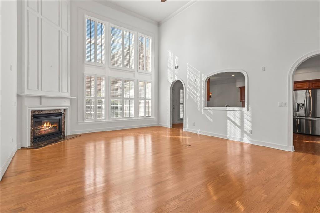 4751 Rosebrook Place Southeast Atlanta, GA 30339 - Photo 9 of 59 a view of an empty room with window and wooden floor