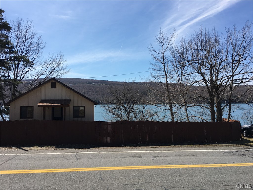1941 Otisco Valley Road Otisco, NY 13110 - Photo 1 of 1 View of the lakefront home from the road