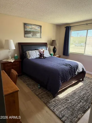 a bedroom with a bed and window