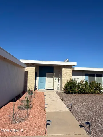a view of a backyard of the house