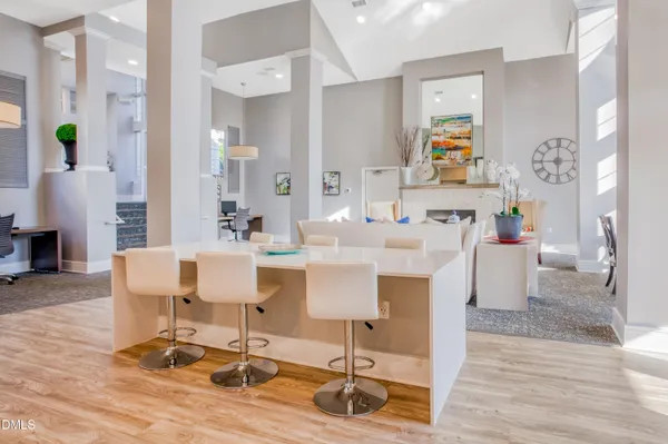 a view of a dining room with furniture and wooden floor