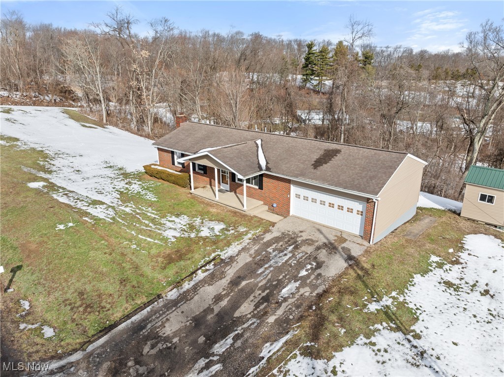 61899 Webb Heights Road Shadyside, OH 43947 - Photo 31 of 39 View of front of house featuring a garage and covered porch