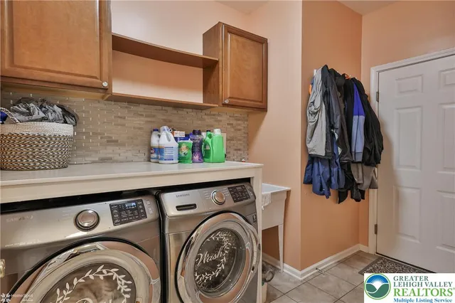 a dining room with furniture and chandelier kitchen view