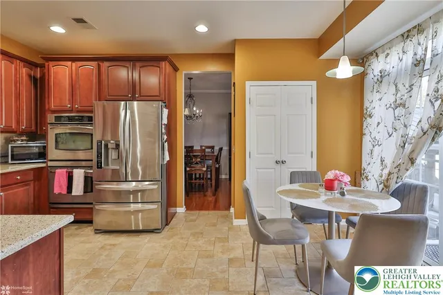 a bedroom with a bed and a flat tv screen