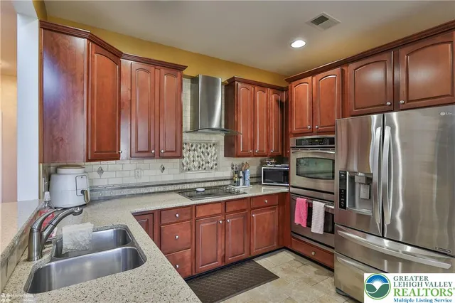 a view of a patio with a table chairs and a patio