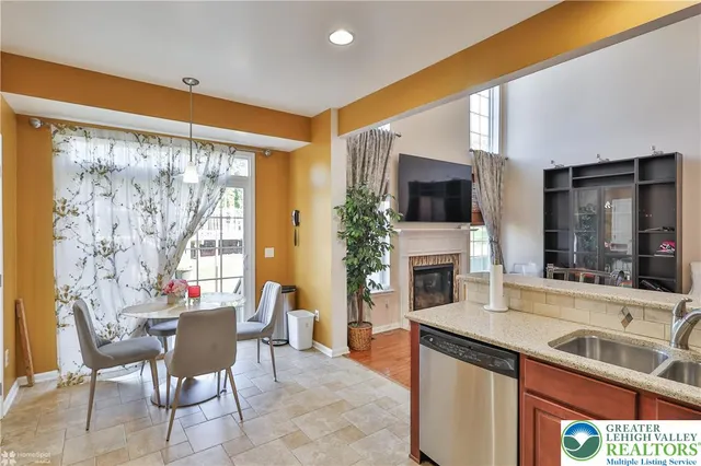 a view of a patio with table and chairs potted plants