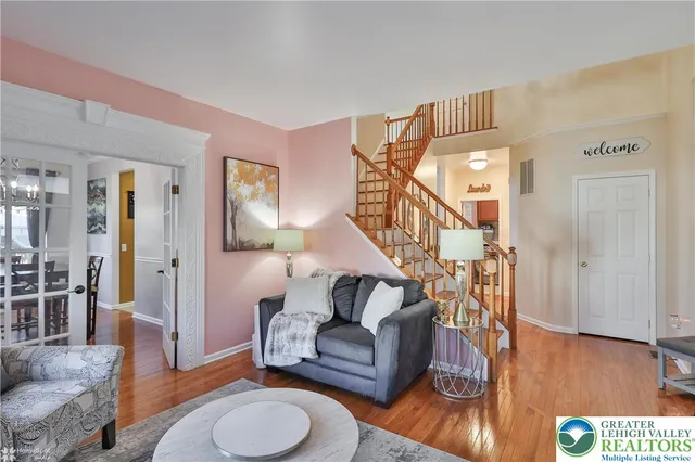 a dining room with furniture and chandelier