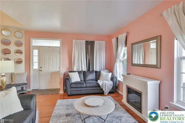 a view of a dining room with furniture and chandelier