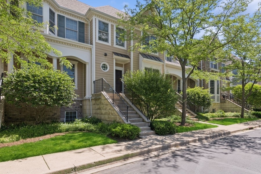 1918 Lynn Circle Libertyville, IL 60048 - Photo 1 of 17 a front view of a house with a yard and plants