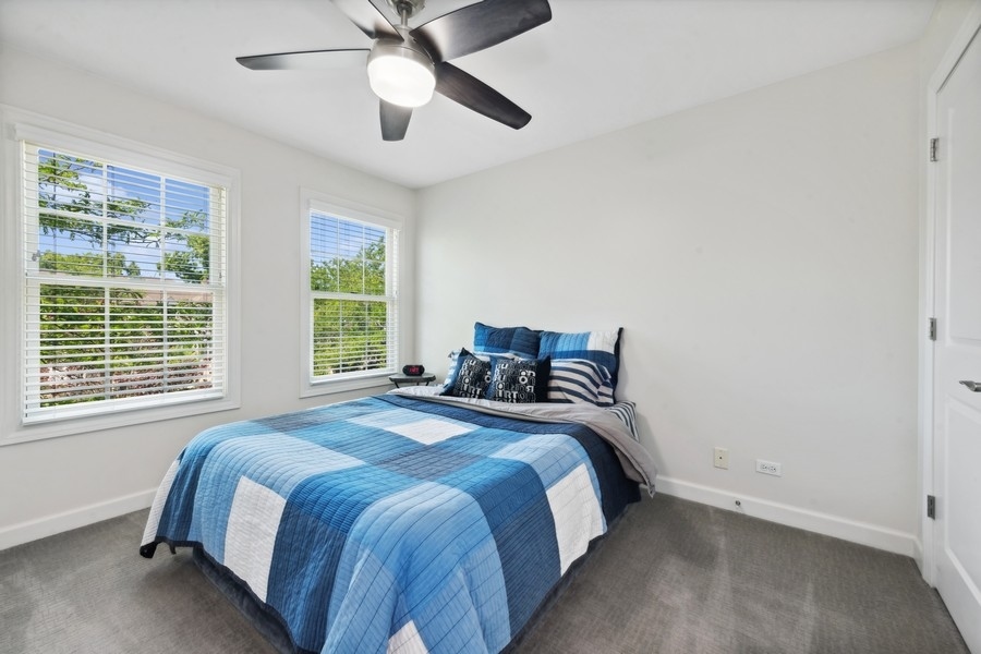 1918 Lynn Circle Libertyville, IL 60048 - Photo 13 of 17 a bedroom with a bed and a large window