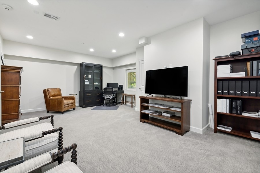 1918 Lynn Circle Libertyville, IL 60048 - Photo 15 of 17 a living room with furniture and a flat screen tv